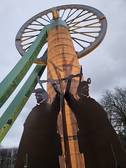 A metal giant figure showing 2 coal miners